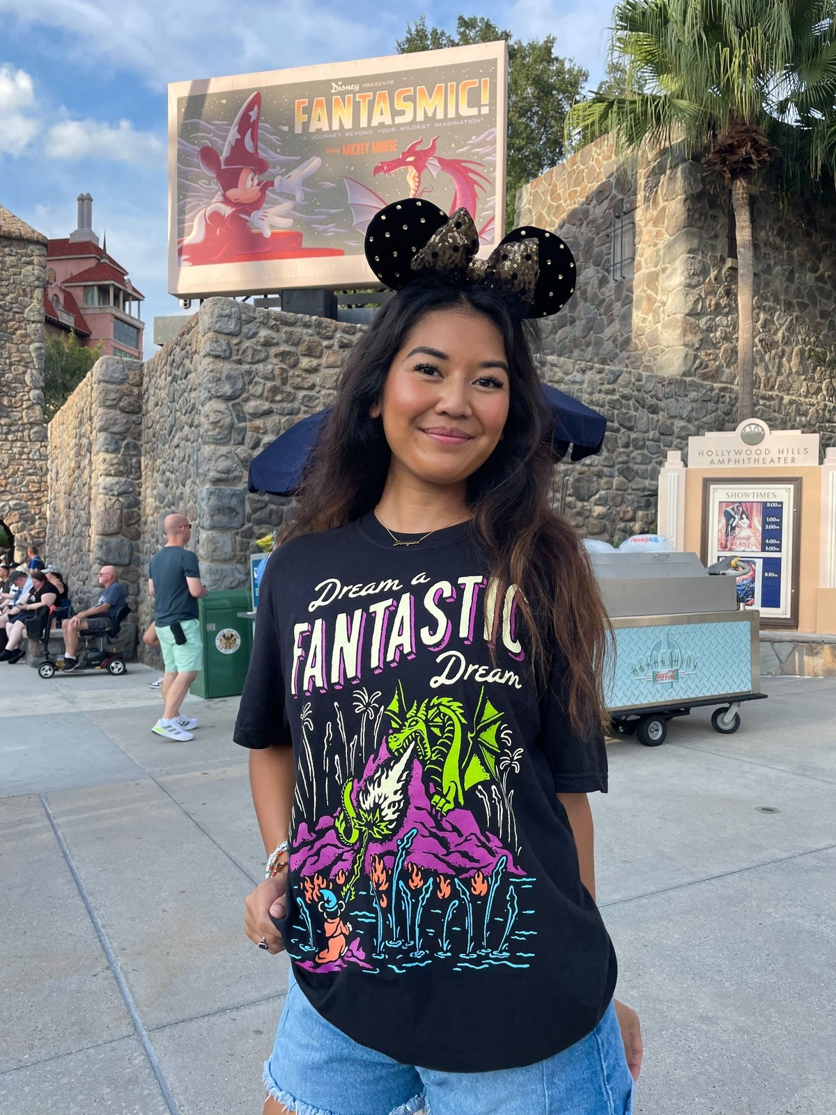 Girl in Mickey Mouse Ears wearing the dreamers Fantasmic Disney-Inspired tee at Hollywood Studios
