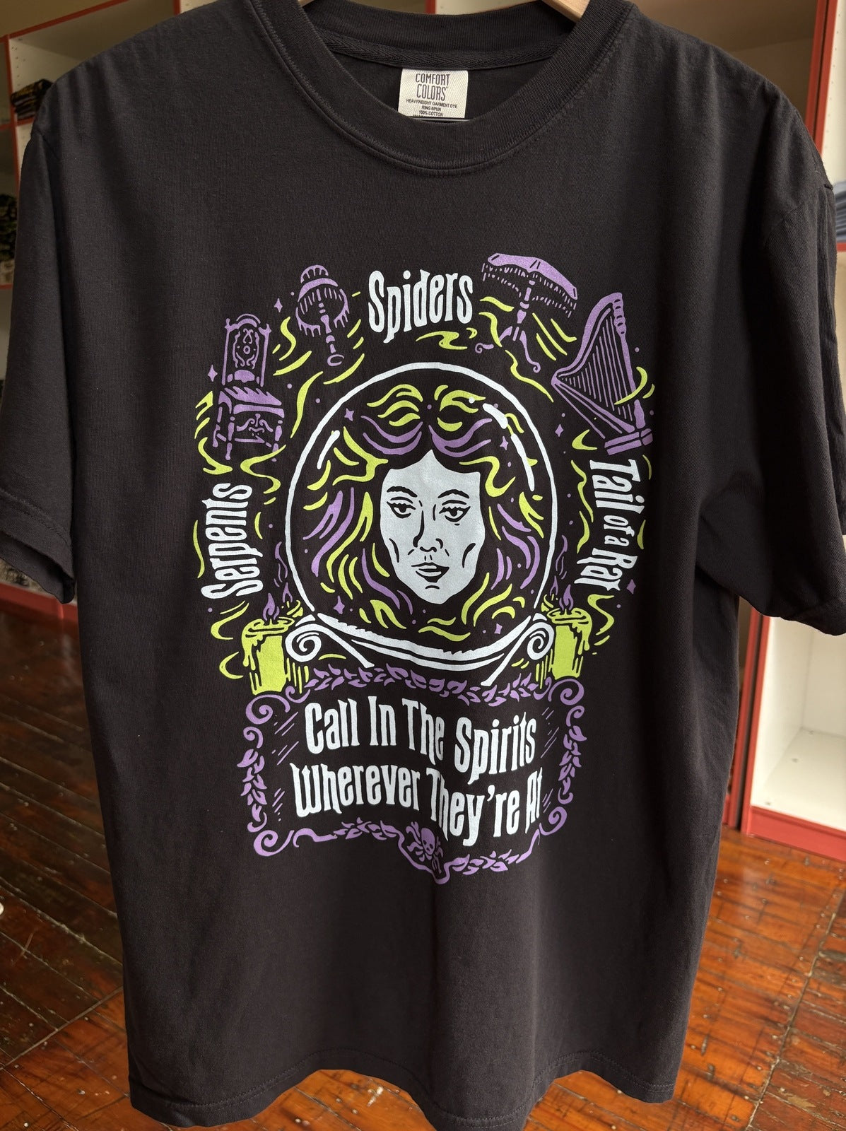 Black Madame Leota inspired shirt from disneys Haunte Mansion featuring her crystal ball.